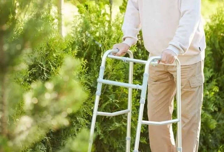 Senior using a walker outdoors